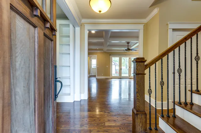 a view of entryway and hall with wooden floor