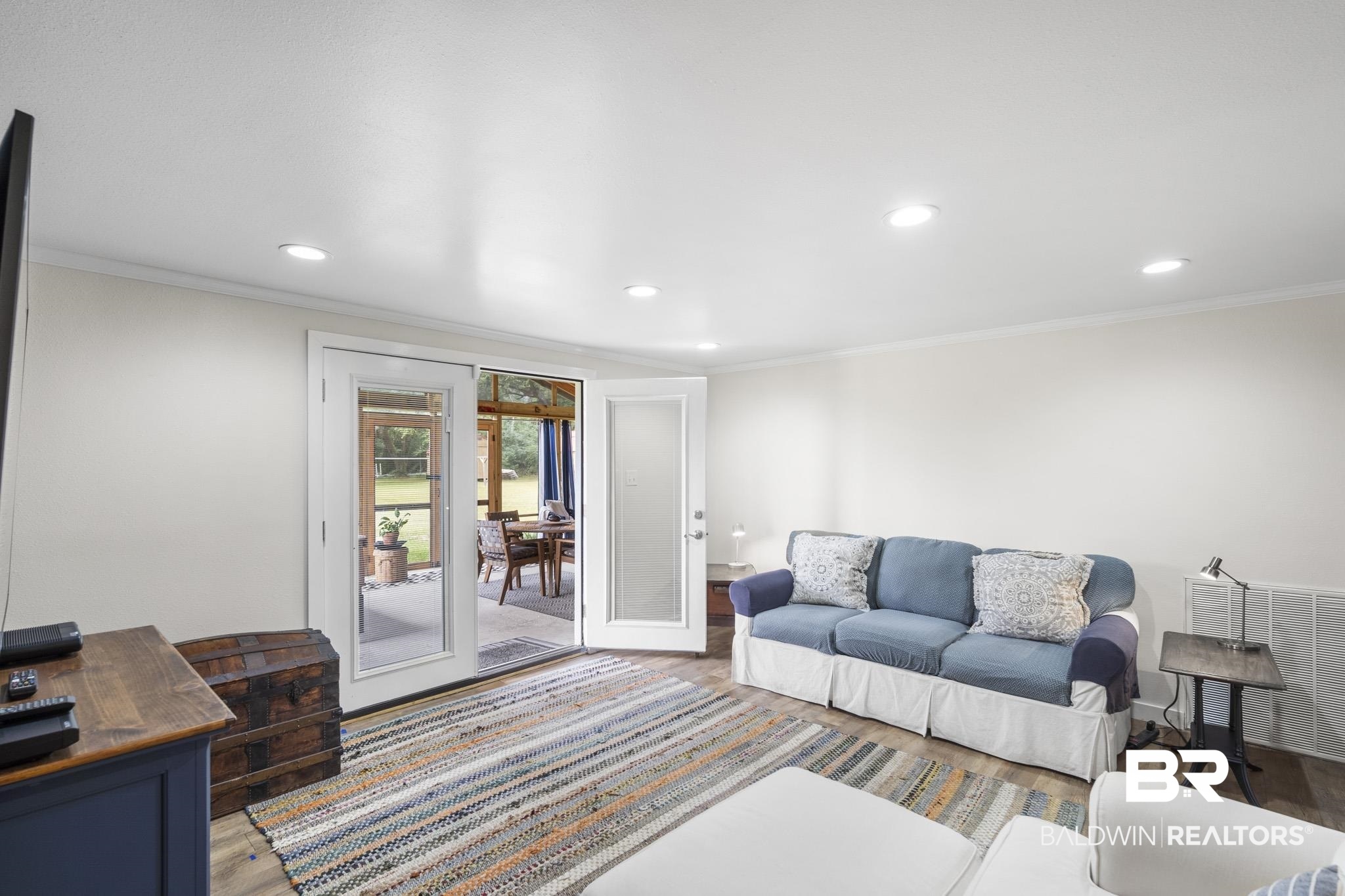 16475 River Park Road Fairhope, AL 36532 - Photo 20 of 37 Living room featuring crown molding, wood-type flooring, and french doors