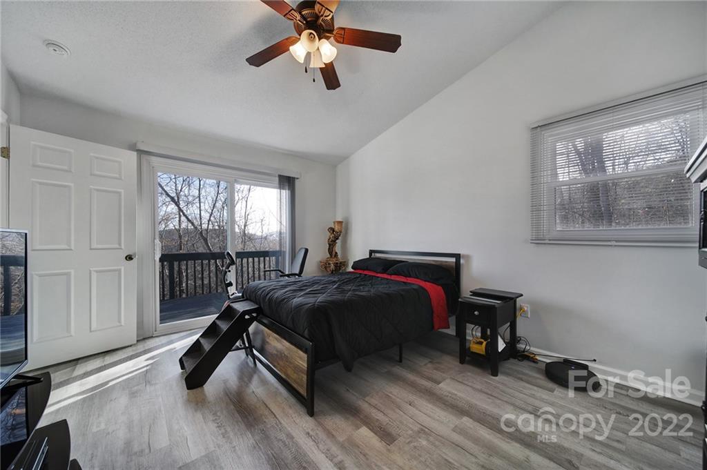 119 Celestial Way Mill Spring, NC 28756 - Photo 12 of 33 a bed room with a bed and a window