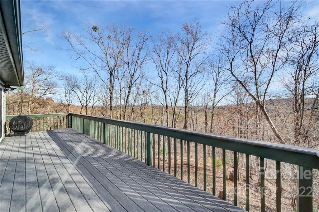119 Celestial Way Mill Spring, NC 28756 - Photo 24 of 33 a view of a balcony with wooden floor and fence