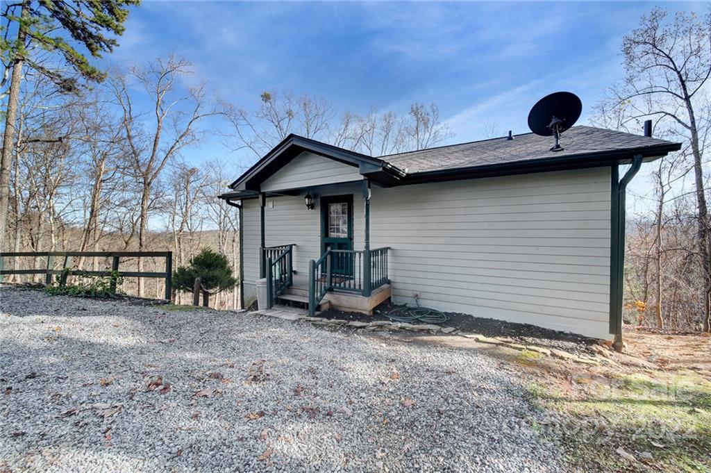 119 Celestial Way Mill Spring, NC 28756 - Photo 28 of 33 a view of a house with a yard and garage