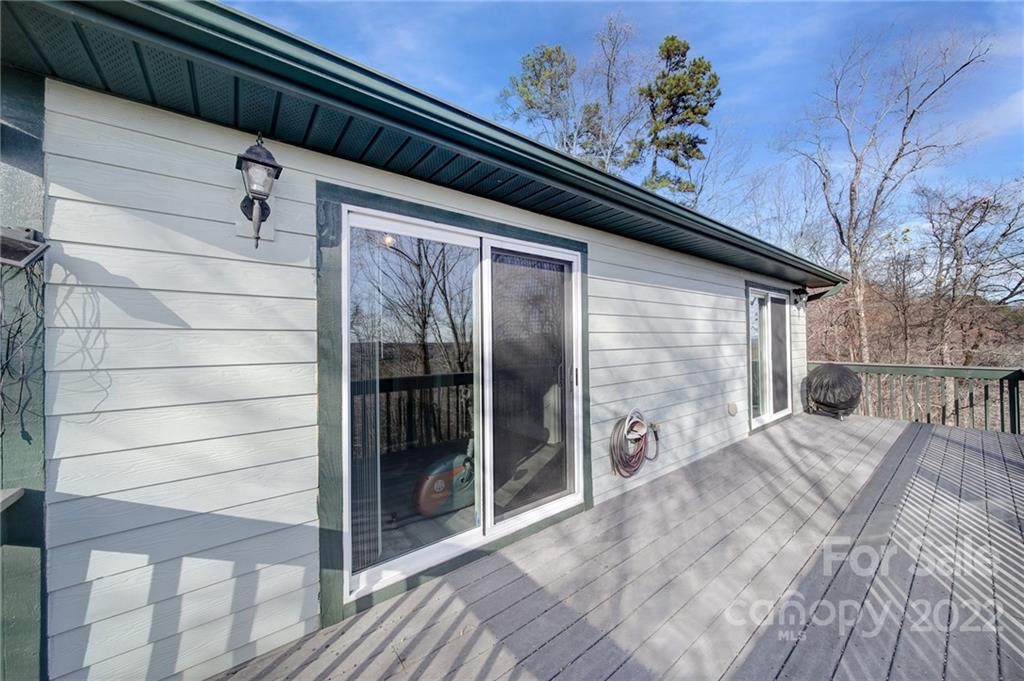 119 Celestial Way Mill Spring, NC 28756 - Photo 3 of 33 a view of a porch with wooden floor and fence