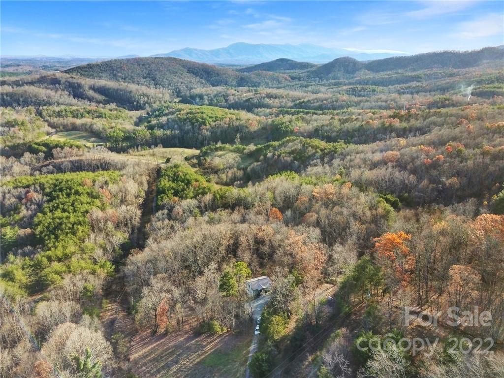 119 Celestial Way Mill Spring, NC 28756 - Photo 31 of 33 a view of lake and mountain
