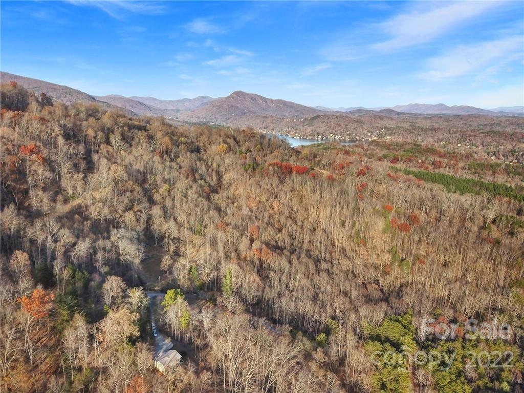 119 Celestial Way Mill Spring, NC 28756 - Photo 33 of 33 a view of a mountain range in a cloudy sky