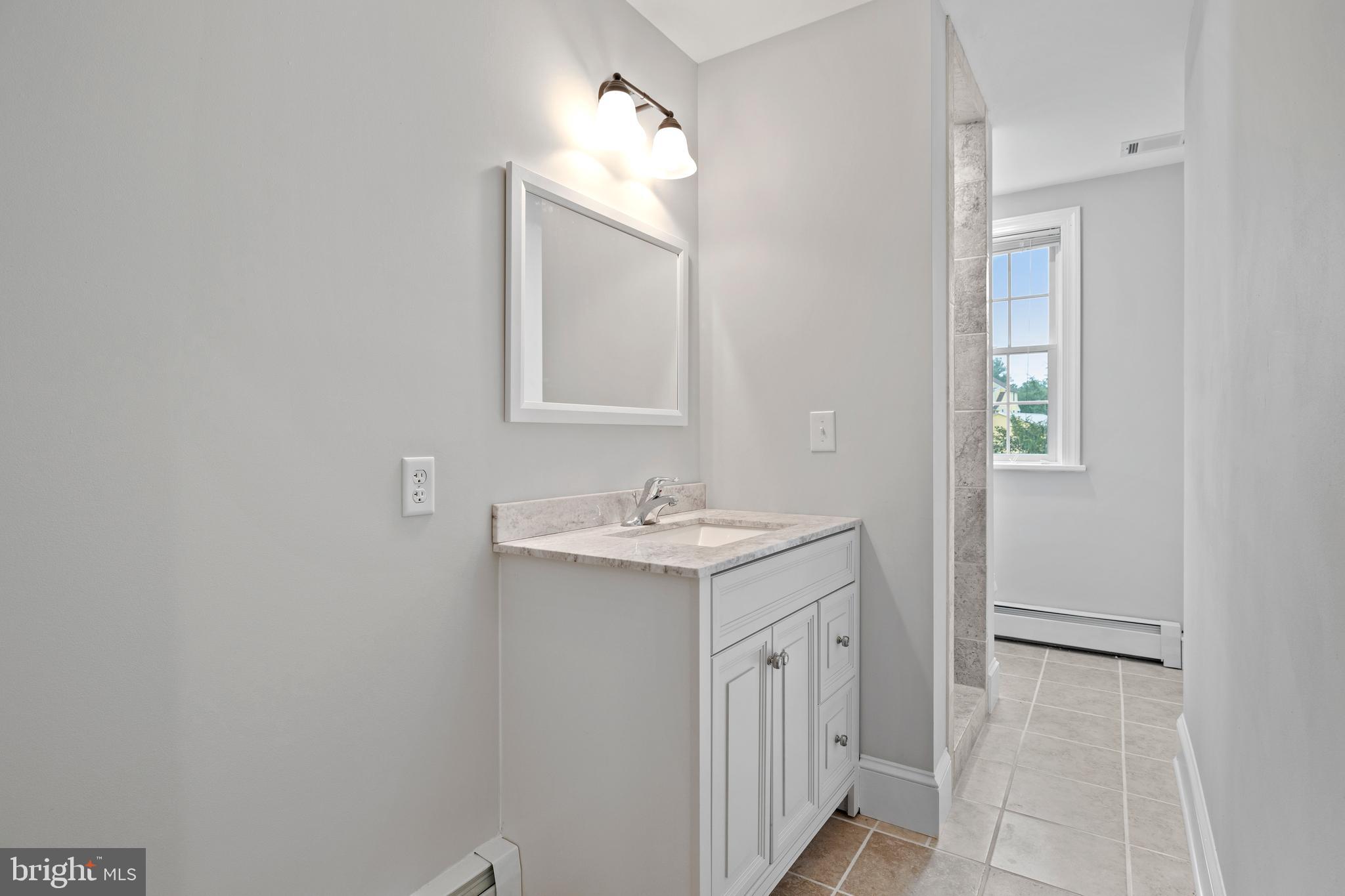3000 Shepperd Road Monkton, MD 21111 - Photo 25 of 34 a bathroom with a sink vanity and a mirror