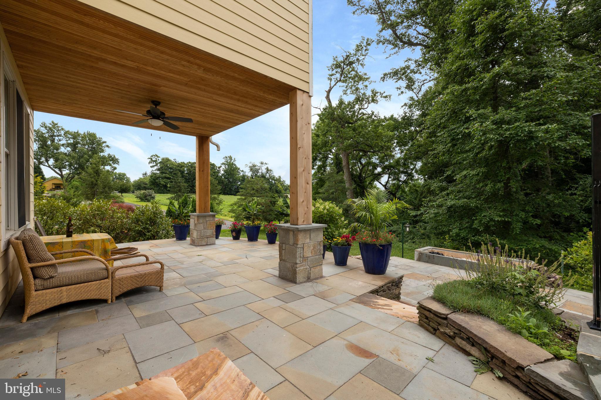 3000 Shepperd Road Monkton, MD 21111 - Photo 3 of 34 a view of a patio with table and chairs potted plants and large tree