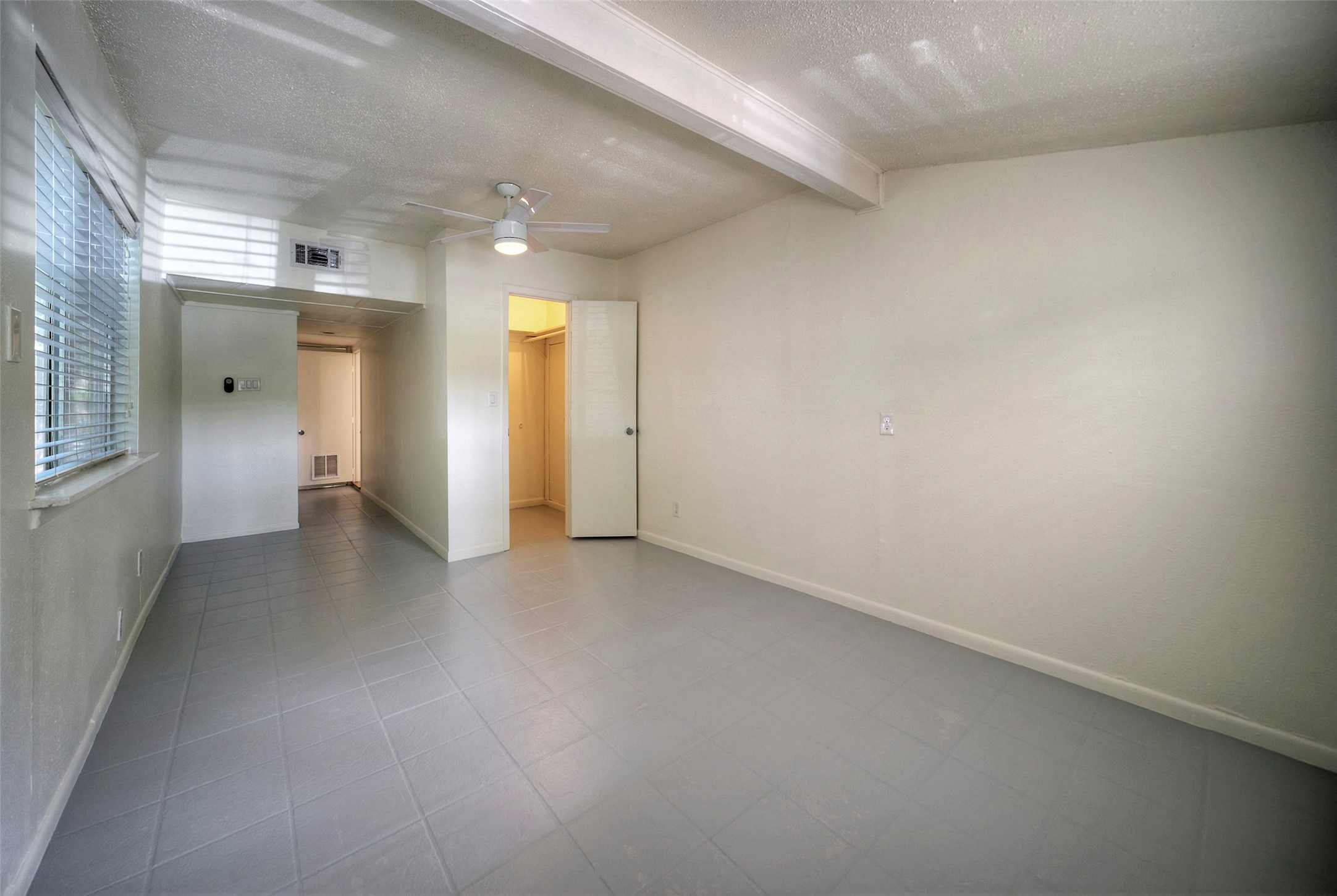 1803 Pearl Street Austin, TX 78701 - Photo 17 of 33 an empty room with closet and a fireplace