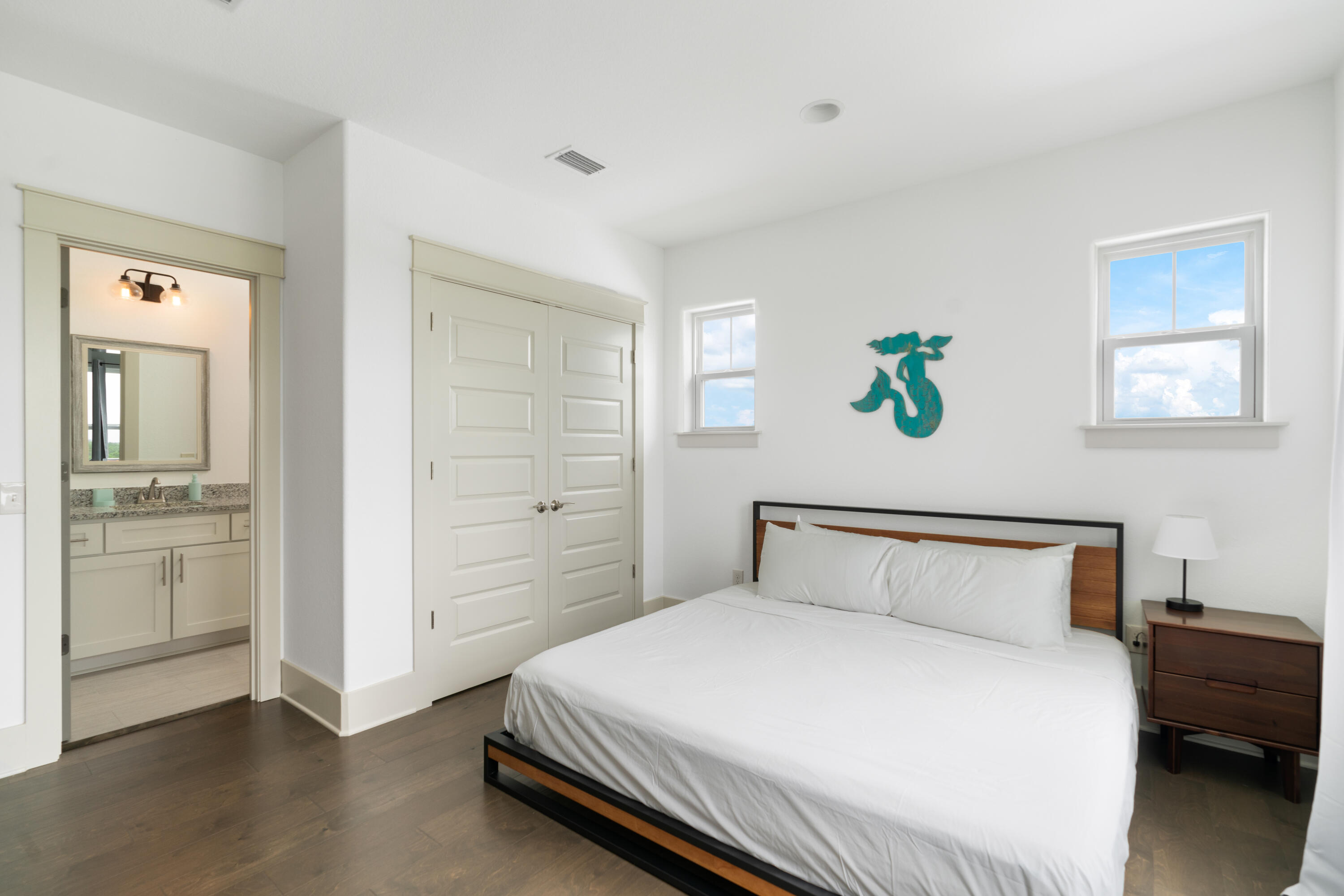 275 Gulfview Circle Santa Rosa Beach, FL 32459 - Photo 21 of 47 a bedroom with a bed and wooden floor