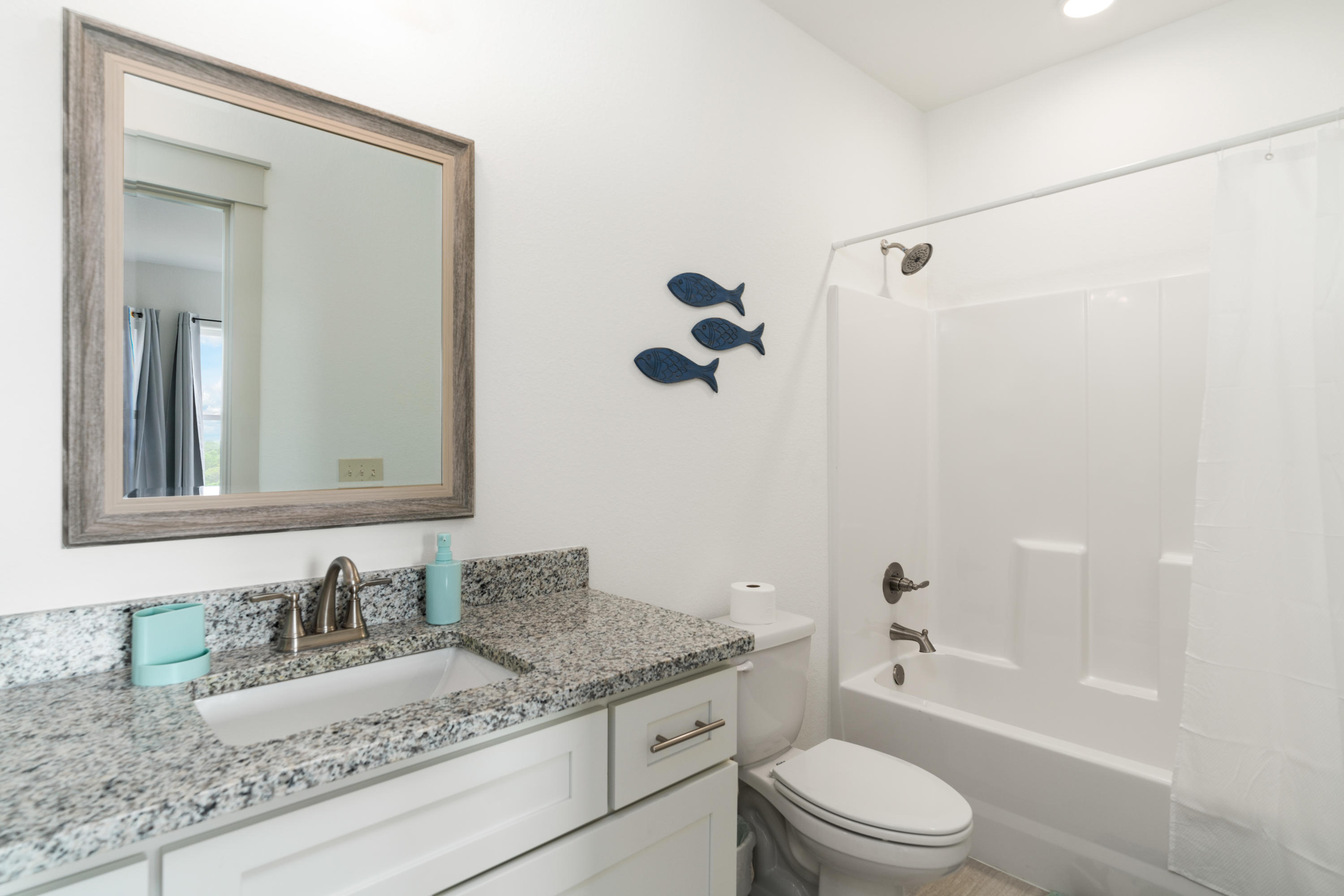 275 Gulfview Circle Santa Rosa Beach, FL 32459 - Photo 23 of 47 a bathroom with a granite countertop sink a toilet and shower