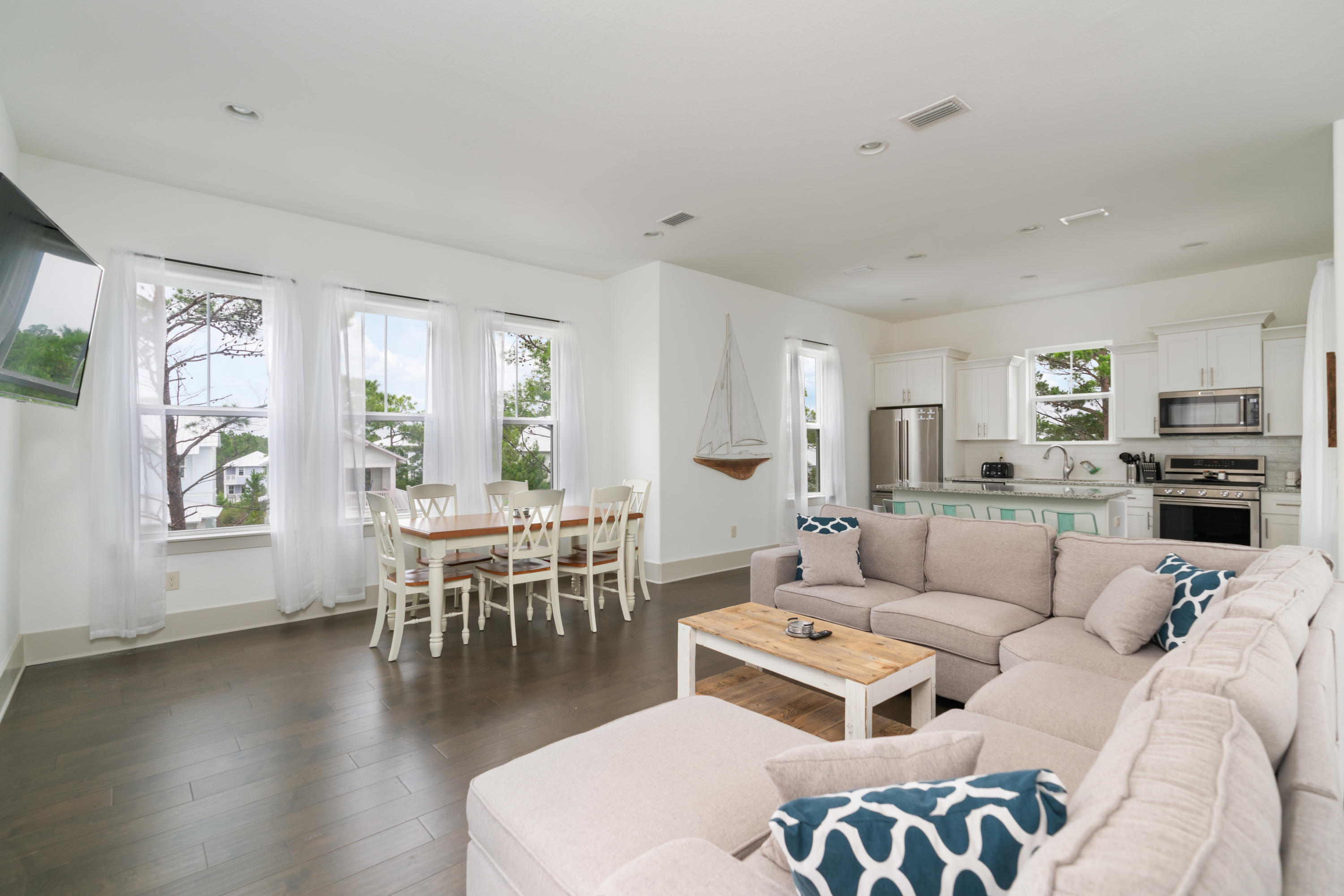 275 Gulfview Circle Santa Rosa Beach, FL 32459 - Photo 6 of 47 a living room with furniture wooden floor and a large window