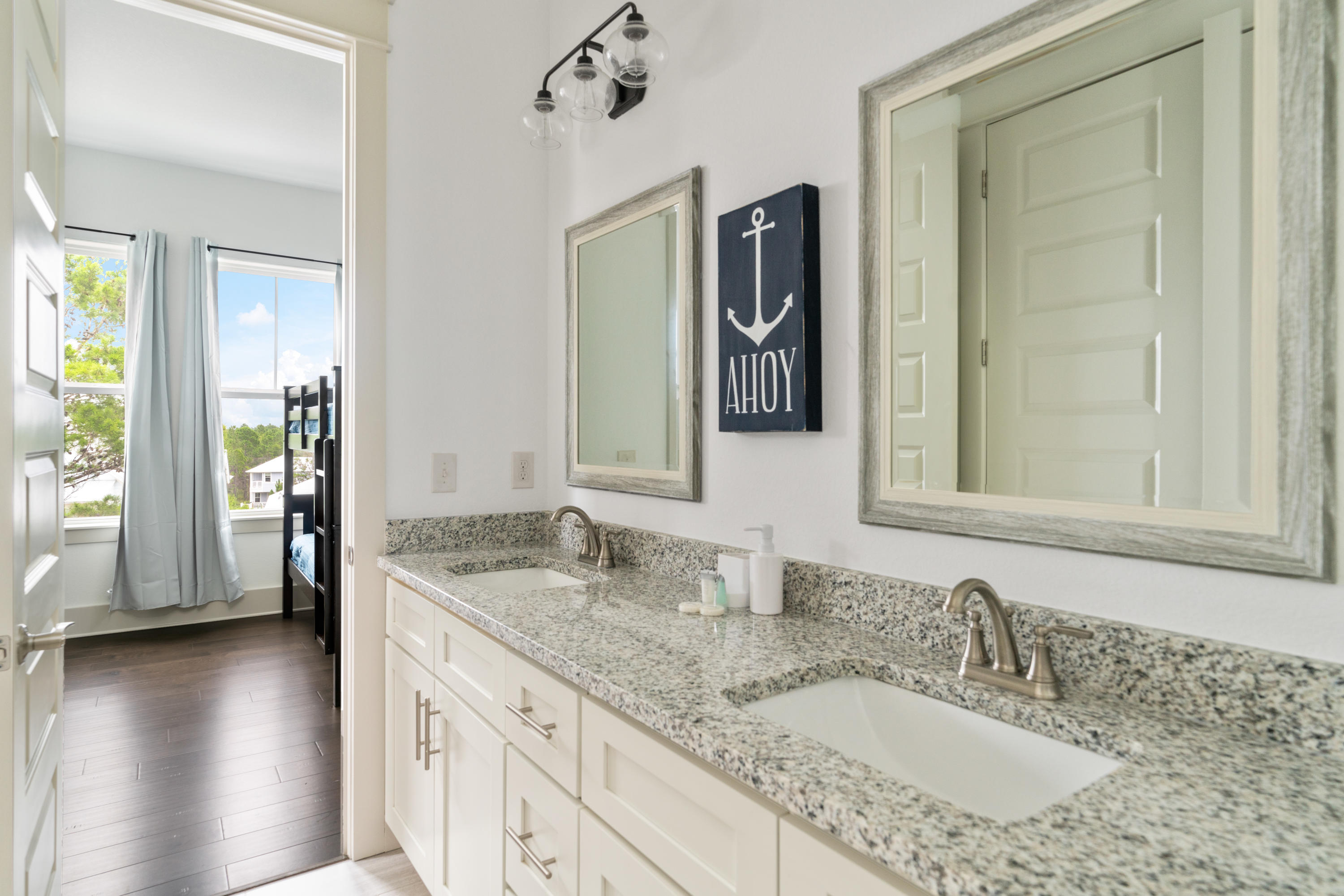 275 Gulfview Circle Santa Rosa Beach, FL 32459 - Photo 10 of 47 a bathroom with a granite countertop sink and a mirror