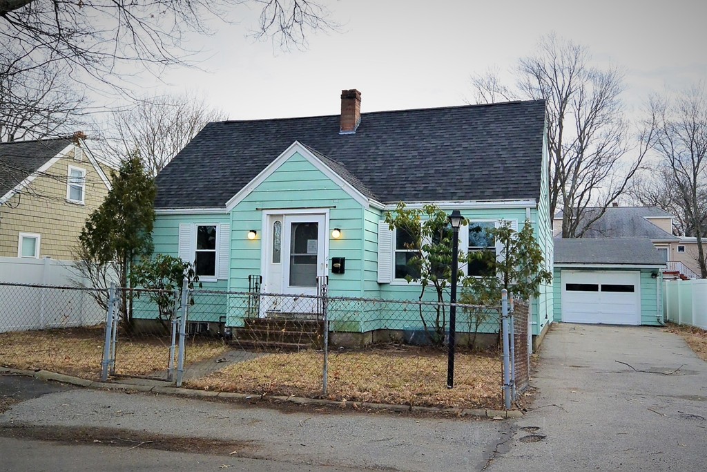 6 Arnold Road Peabody, MA 01960 - Photo 1 of 24 a view of a house with a yard and garage