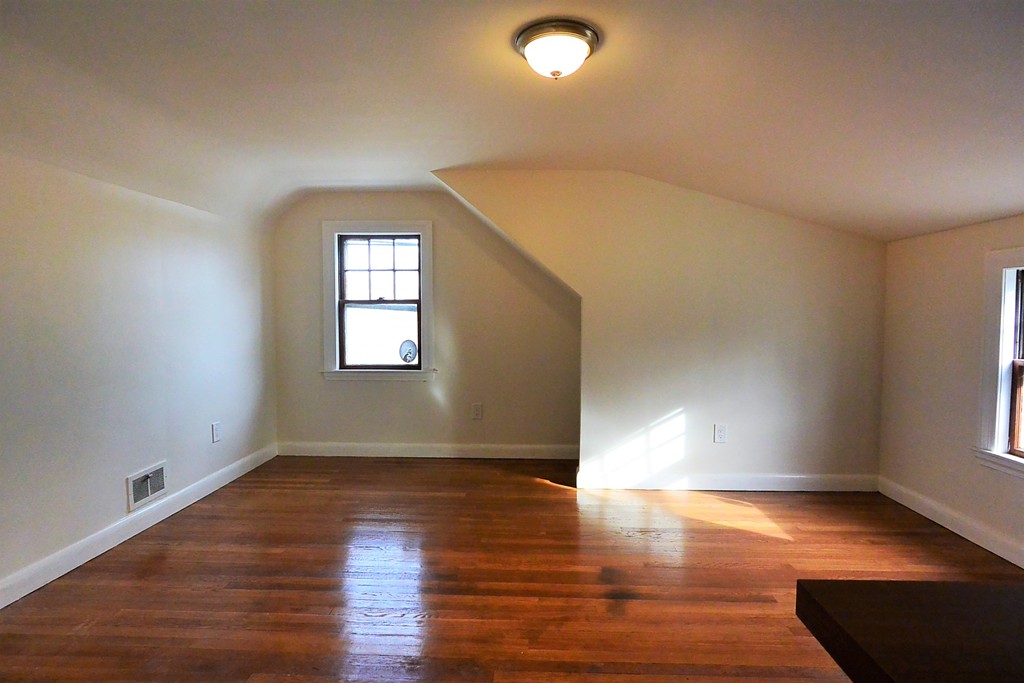 6 Arnold Road Peabody, MA 01960 - Photo 17 of 24 a view of empty room with wooden floor and fan