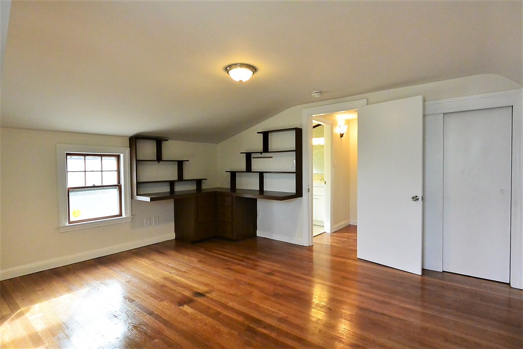 6 Arnold Road Peabody, MA 01960 - Photo 18 of 24 a view of empty room with wooden floor and window