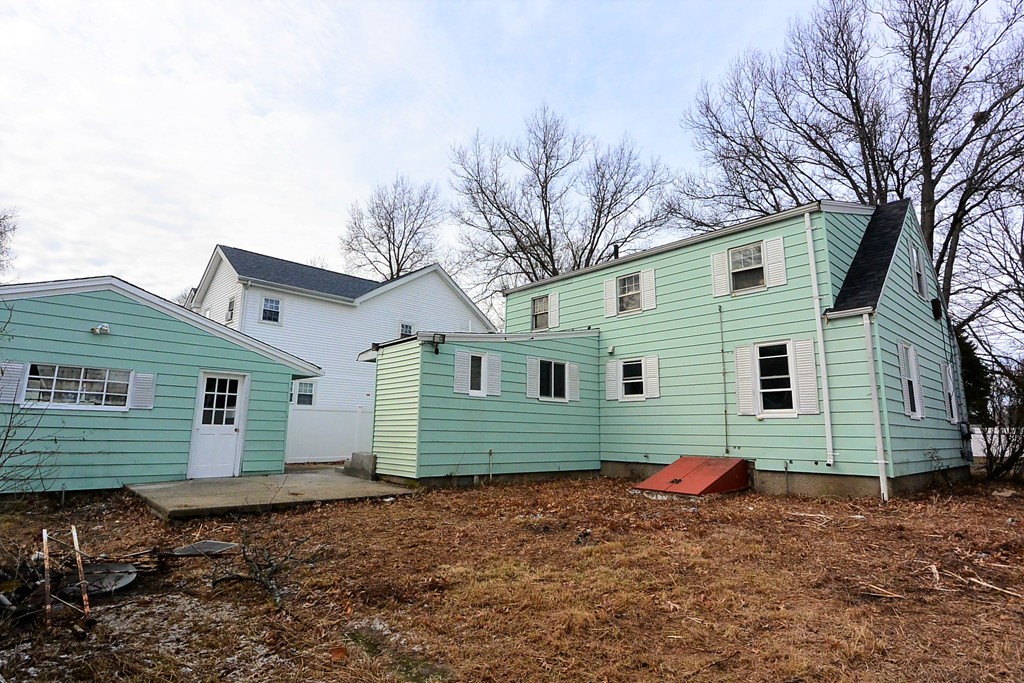 6 Arnold Road Peabody, MA 01960 - Photo 21 of 24 a view of a house with a yard