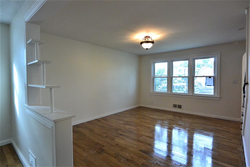 6 Arnold Road Peabody, MA 01960 - Photo 4 of 24 wooden floor in an empty room with a window