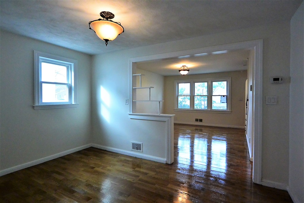 6 Arnold Road Peabody, MA 01960 - Photo 7 of 24 a view of an empty room with wooden floor and a window