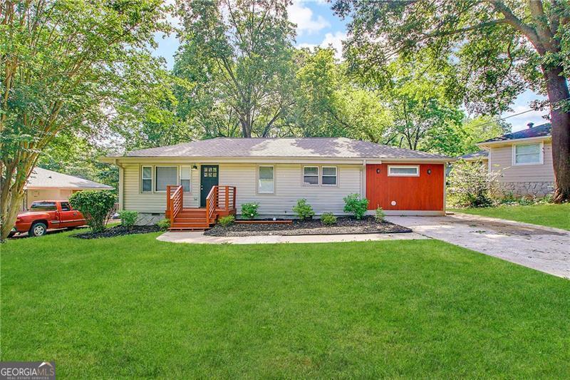 a view of a house with a yard patio and a patio