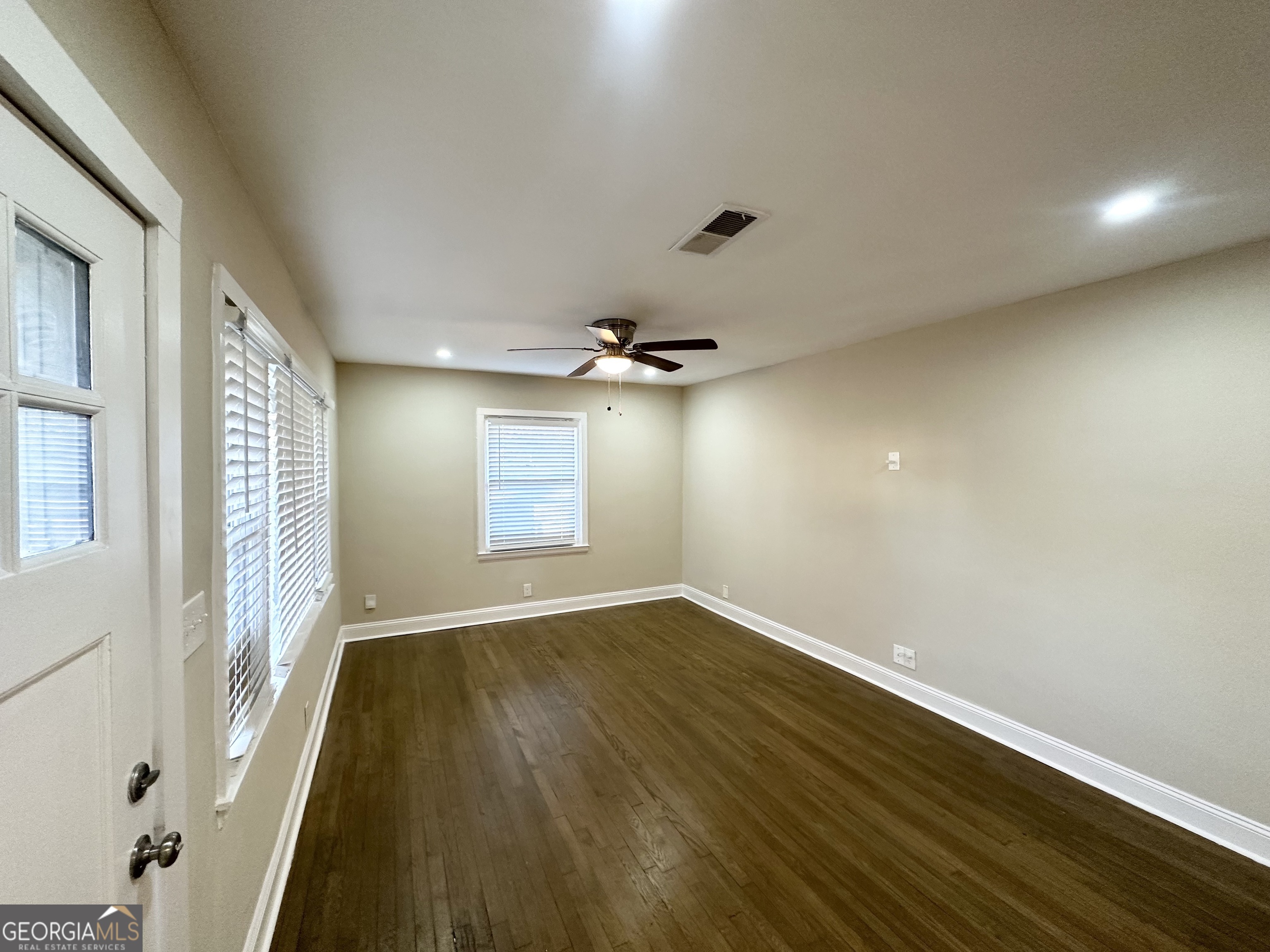 1996 Meadow Lane Decatur, GA 30032 - Photo 3 of 13 wooden floor in an empty room with a window