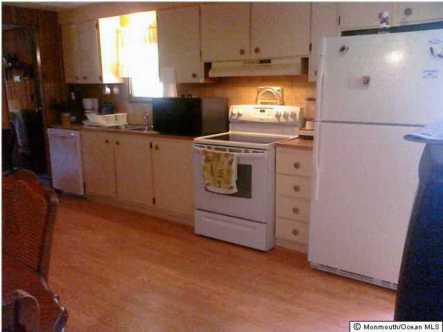 29 Cathy Court Jackson, NJ 08527 - Photo 2 of 3 a kitchen with a refrigerator sink and cabinets