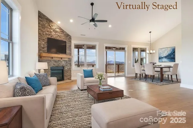 a living room with fireplace furniture and a flat screen tv