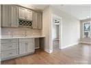 a view of cabinets and wooden floor