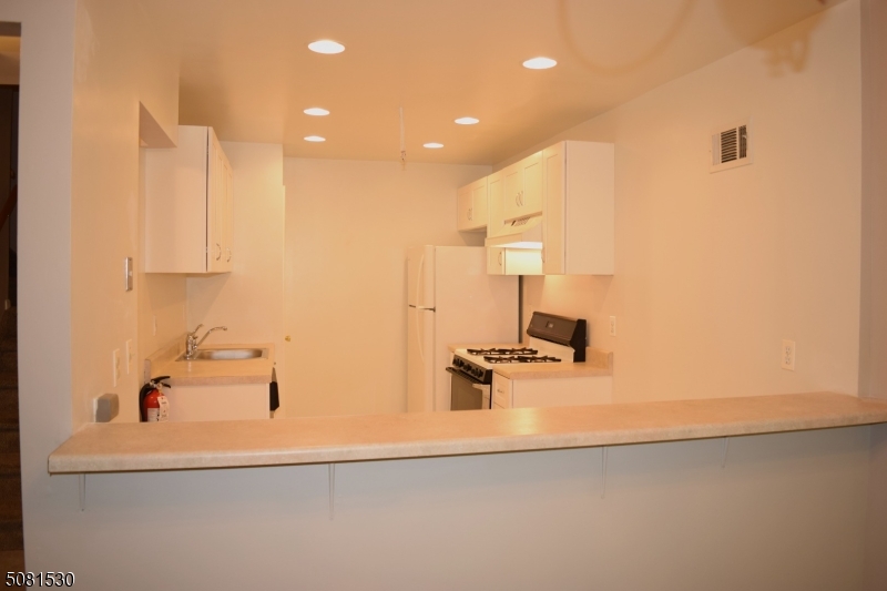 177 Riveredge Drive Chatham, NJ 07928 - Photo 6 of 17 a bathroom with a sink and a mirror