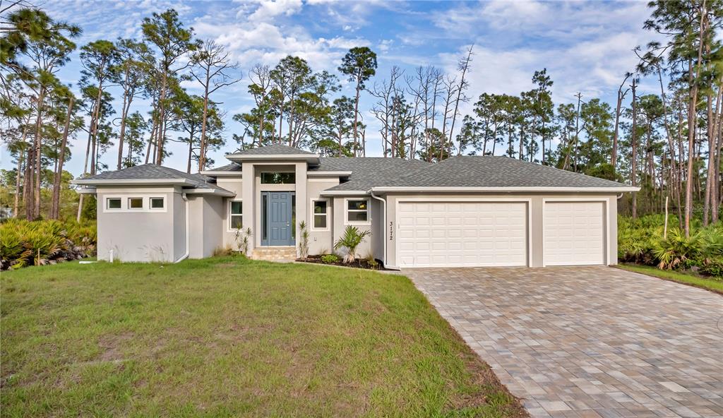 3172 Dutton Street Port Charlotte, FL 33948 - Photo 1 of 1 front view of a house with a big yard