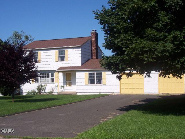 76 Walnut Hill Road Bethel, CT 06801 - Photo 1 of 1 a front view of a house with a yard and garage