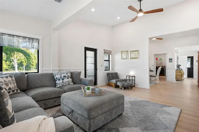 a living room with furniture and a window