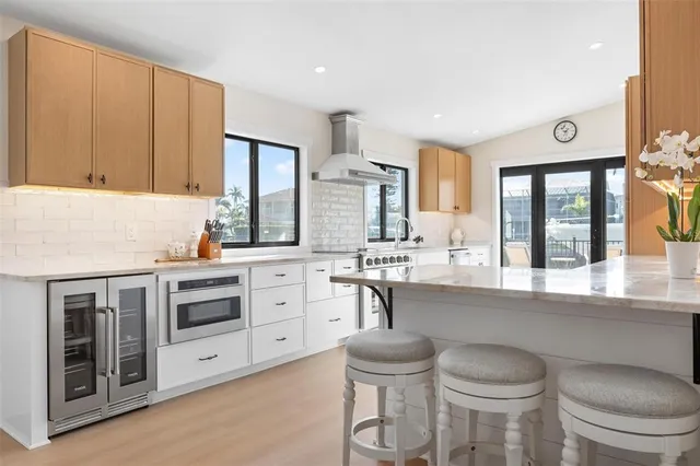 a kitchen with stainless steel appliances granite countertop a stove and a refrigerator