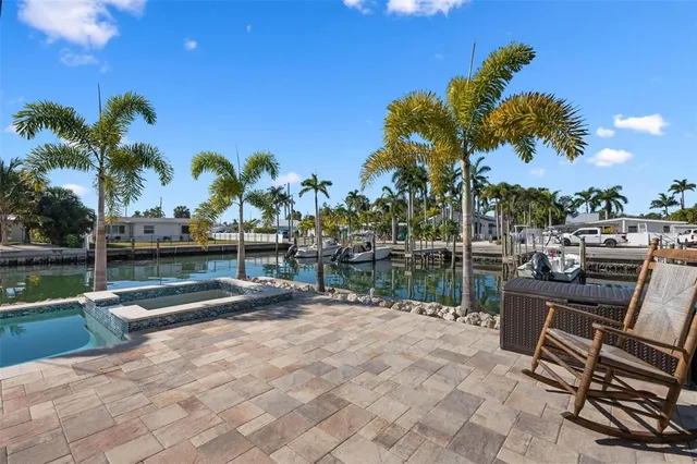 a front view of house with yard and swimming pool