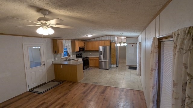 735 Memorial Drive, Unit 40 Chicopee, MA 01020 - Photo 12 of 20 a view of kitchen with refrigerator stove microwave and cabinets
