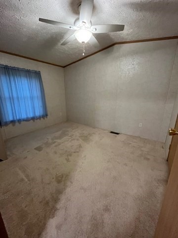 735 Memorial Drive, Unit 40 Chicopee, MA 01020 - Photo 14 of 20 an empty room with a ceiling fan and a window
