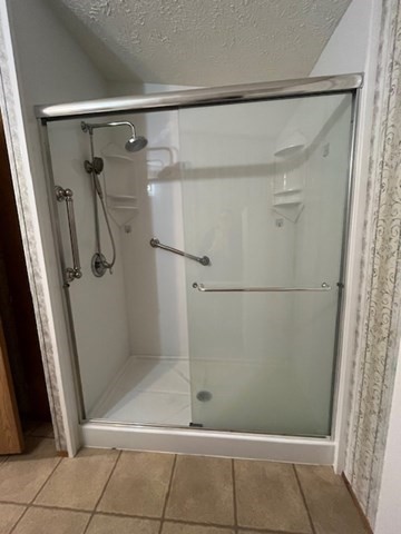735 Memorial Drive, Unit 40 Chicopee, MA 01020 - Photo 19 of 20 a bathroom with a glass shower door