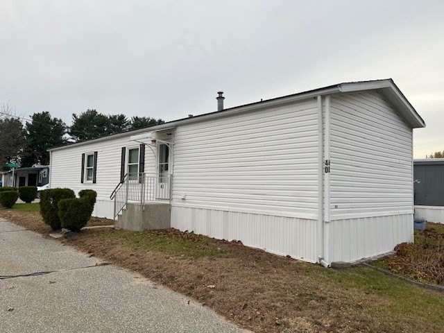 735 Memorial Drive, Unit 40 Chicopee, MA 01020 - Photo 3 of 20 a view of a house with a backyard