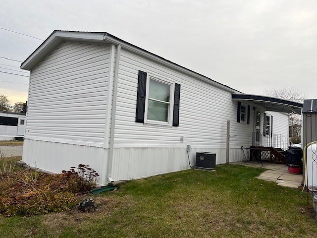 735 Memorial Drive, Unit 40 Chicopee, MA 01020 - Photo 4 of 20 a view of a house with backyard