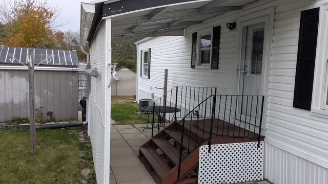 a view of balcony with furniture
