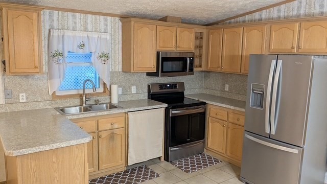 735 Memorial Drive, Unit 40 Chicopee, MA 01020 - Photo 8 of 20 a kitchen with granite countertop a refrigerator stove and sink