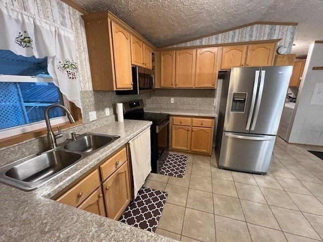 735 Memorial Drive, Unit 40 Chicopee, MA 01020 - Photo 9 of 20 a kitchen with stainless steel appliances granite countertop a refrigerator a sink a stove a washer dryer and a window