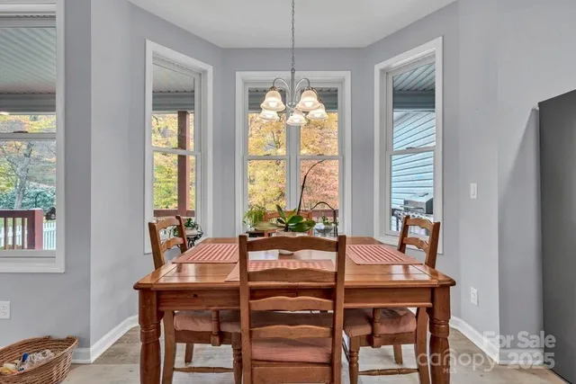 a kitchen with sink a microwave and cabinets