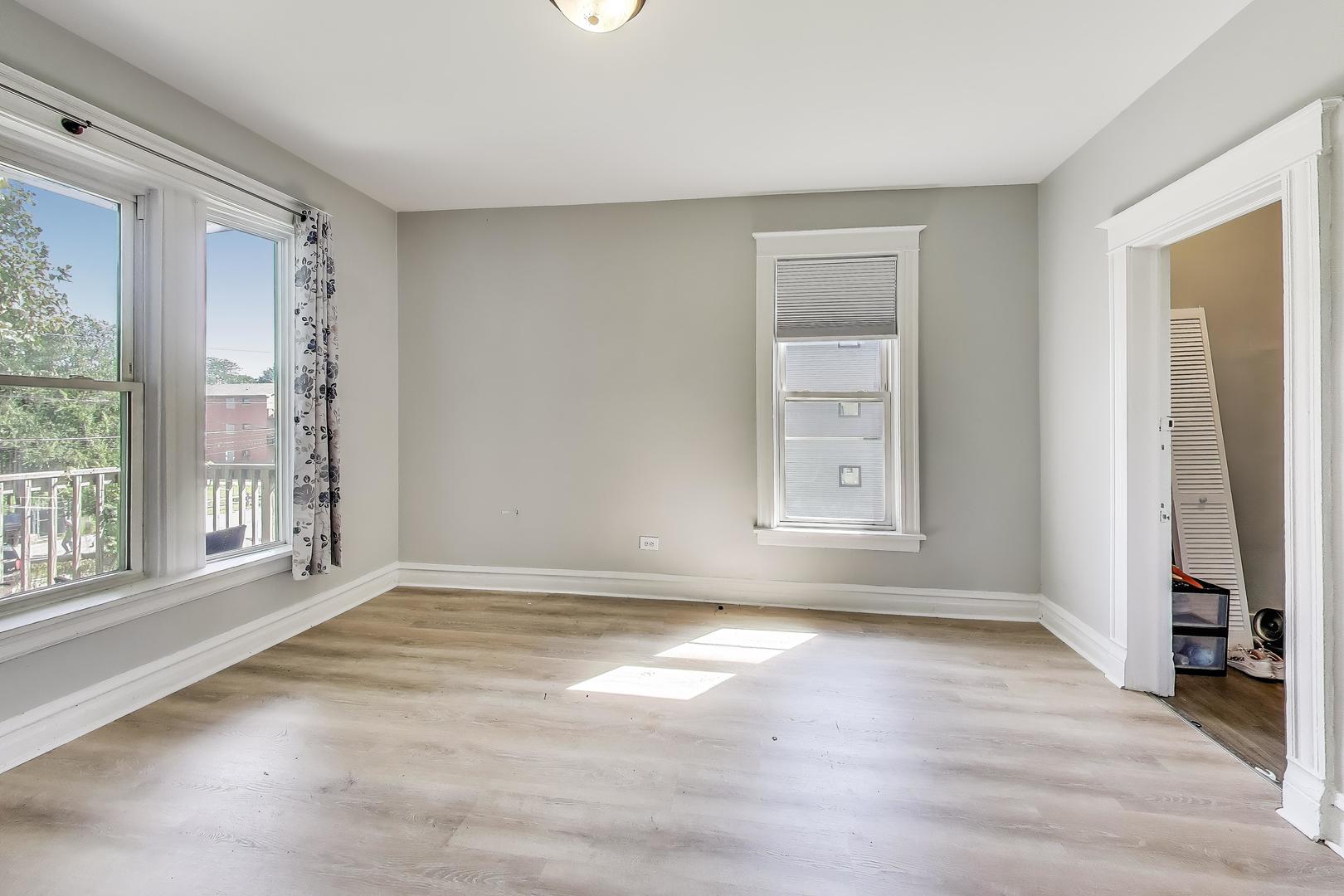 5169 South Michigan Avenue, Unit 2 Chicago, IL 60615 - Photo 11 of 21 a view of an empty room with glass door and windows