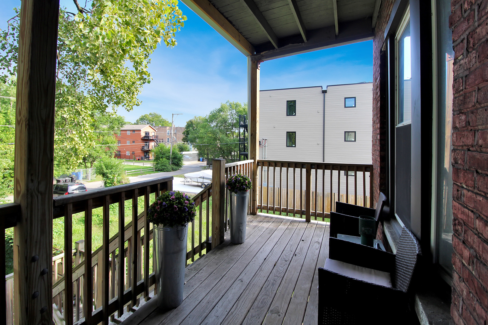 5169 South Michigan Avenue, Unit 2 Chicago, IL 60615 - Photo 20 of 21 a view of a balcony with wooden floor