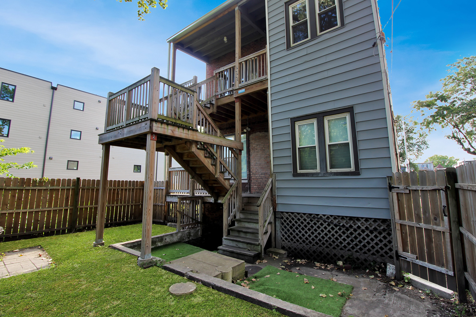5169 South Michigan Avenue, Unit 2 Chicago, IL 60615 - Photo 21 of 21 a view of a house with a yard