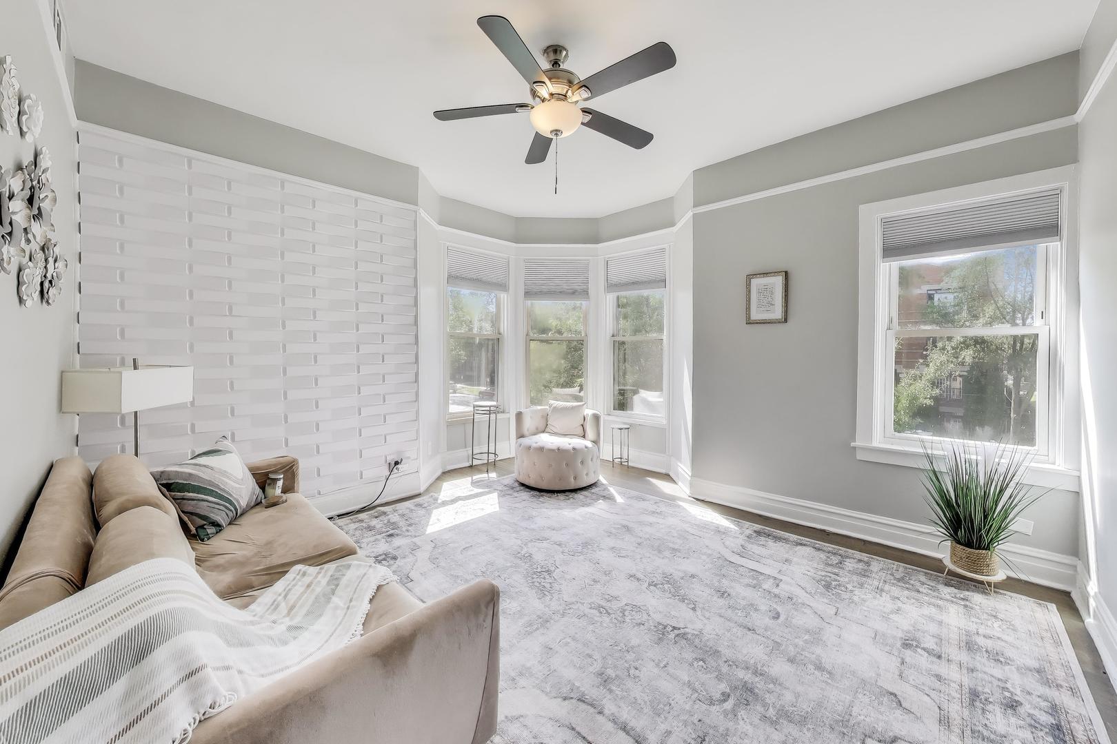 5169 South Michigan Avenue, Unit 2 Chicago, IL 60615 - Photo 4 of 21 a living room with furniture and a large window