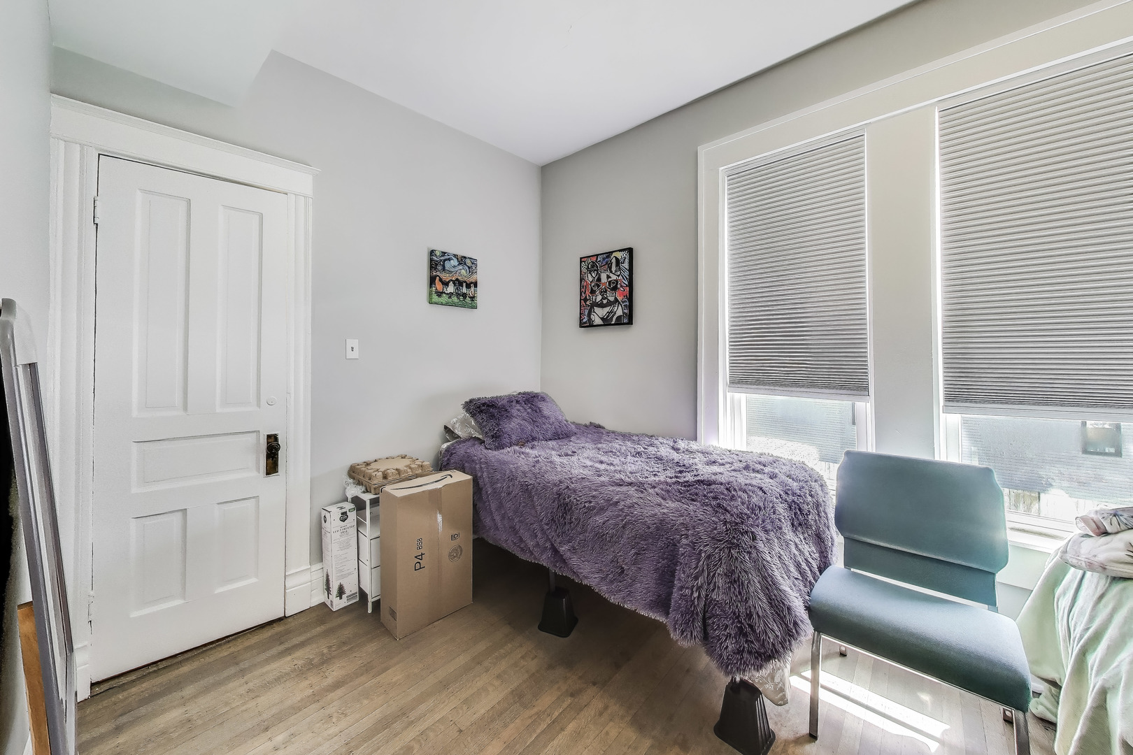 5169 South Michigan Avenue, Unit 2 Chicago, IL 60615 - Photo 8 of 21 a bed room with a bed and a chair