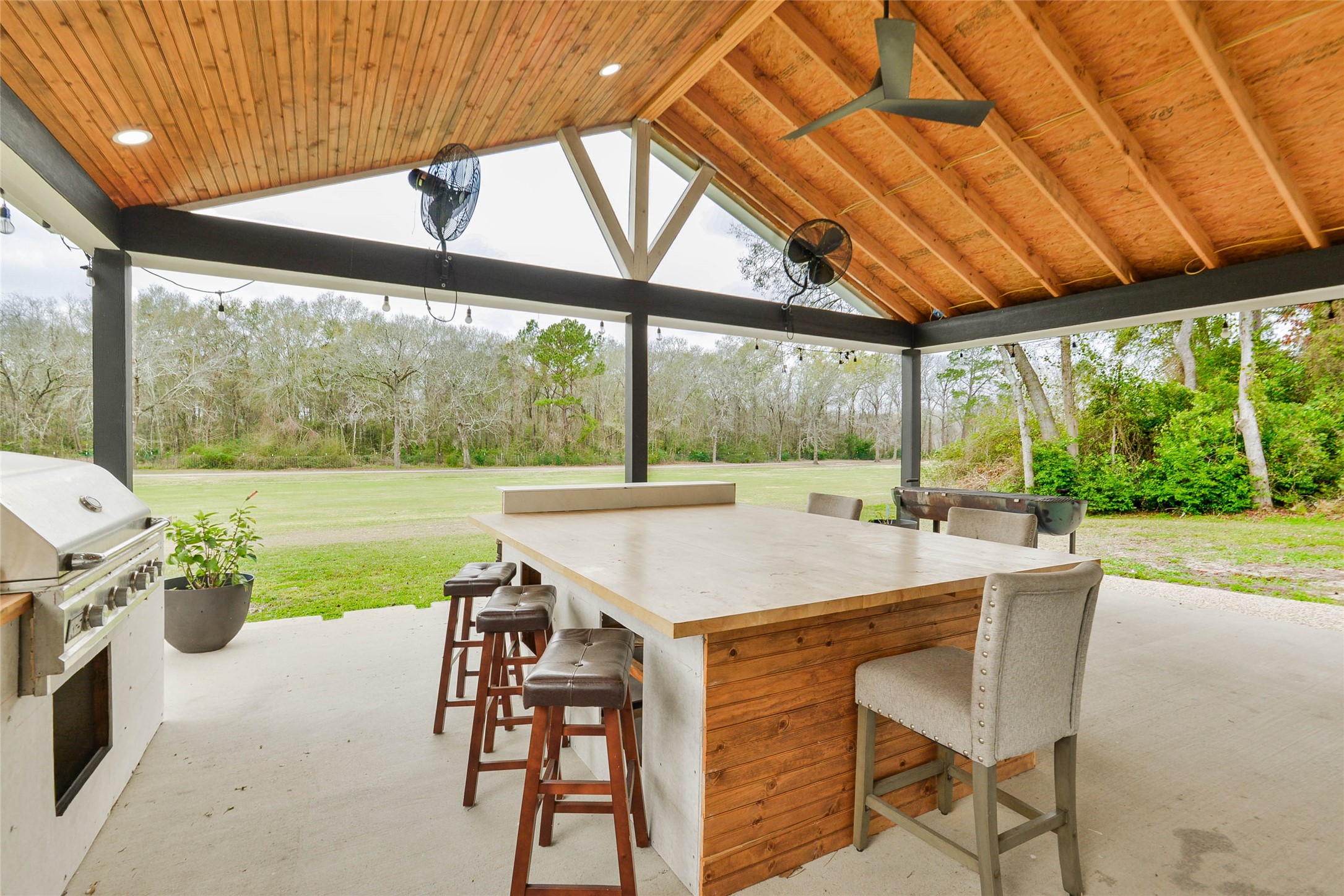 531 Brandon Road Conroe, TX 77302 - Photo 5 of 33 a table and chairs with the ocean view