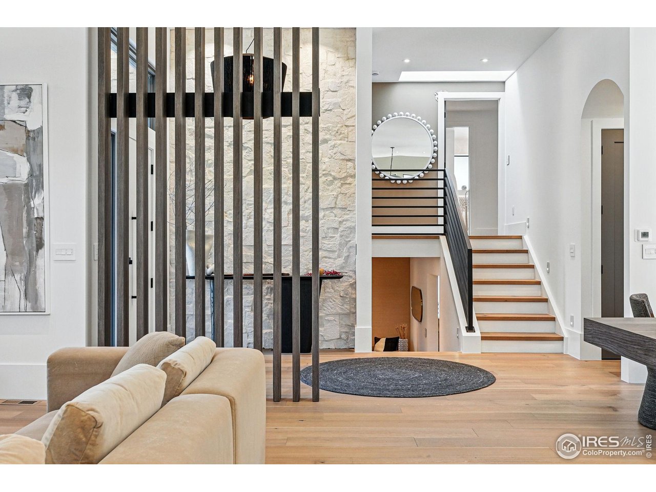 6923 Hunter Place Boulder, CO 80301 - Photo 12 of 34 a bedroom with a bed and a walk in closet