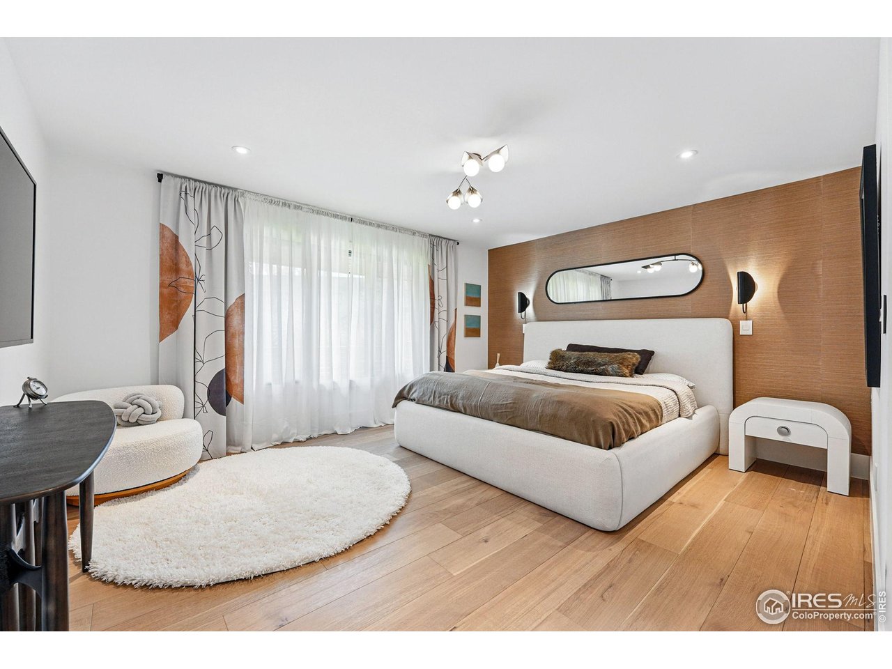 6923 Hunter Place Boulder, CO 80301 - Photo 15 of 34 a bedroom with a bed and a couch