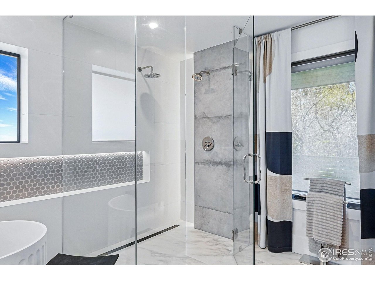 6923 Hunter Place Boulder, CO 80301 - Photo 20 of 34 a bathroom with a shower sink and mirror